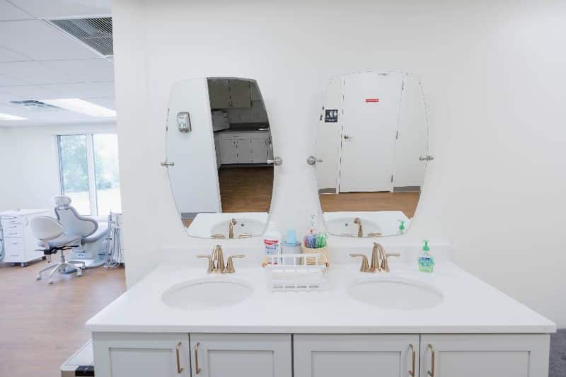 Maddux orthodontics double vanity sink with mirrors