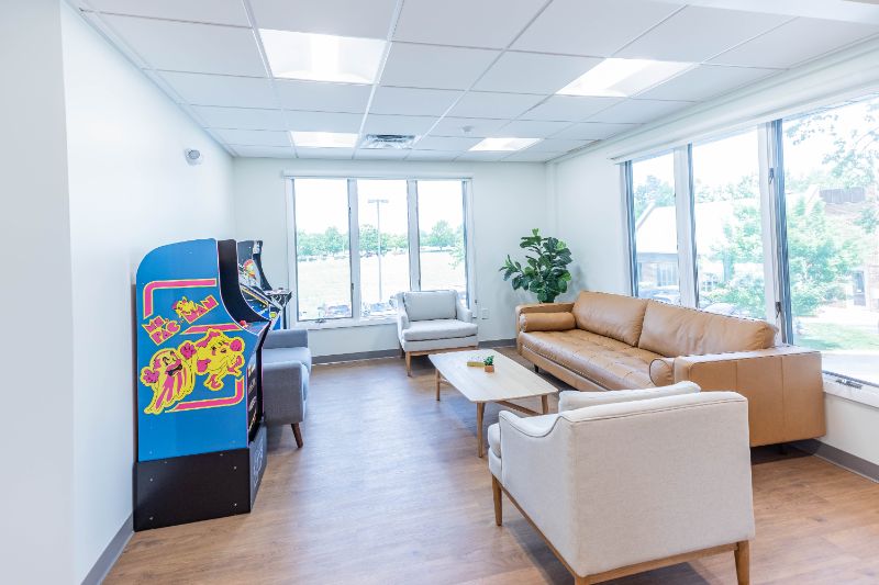 Maddux orthodontics waiting area with arcade game systems