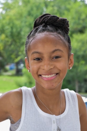 Maddux orthodontics patient young girl smiling after treatment