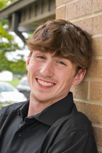Maddux orthodontics patient young man smiling after treatment
