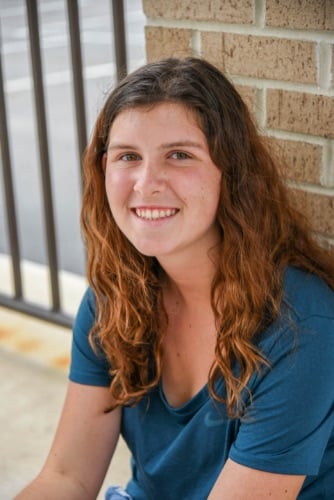 Maddux orthodontics patient girl smiling after treatment