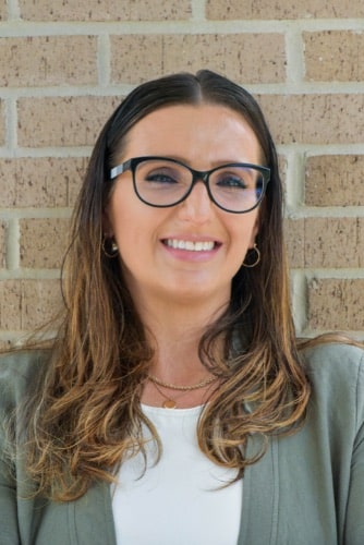 Maddux orthodontics patient adult woman smiling after treatment