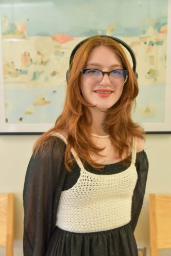 Maddux orthodontic patient after treatment smiling with straight teeth