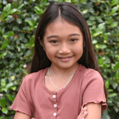 Little girl with long hair in nature,